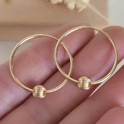 Aro argolla Oro 14K G.F 24 mm con bolita facetada
